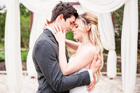 Bride and groom embrace at the Terrace Club, one of Austin’s best wedding venues.