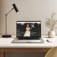 Laptop displaying home page from La Belle Journée, a Showit website template for destination wedding planners