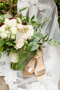 Wedding bouquet at shoes at a Gervasi Vineyard wedding photographed by akron ohio wedding photographer
