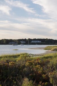 A coastal New England family session with toes in the sand and salty snuggles by the water's edge. North Shore Family Photographer. Deborah Zoe Photography.
