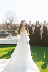 bride in billowy wedding gown with sleeves