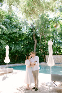Parents smiling at newborn baby lifestyle newborn photographer South Florida