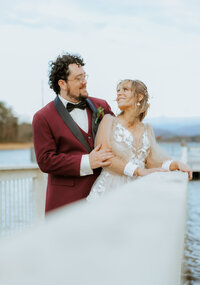 Married couple posing on dock at The Ridges Resort In north georgia