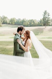 laughing-newlyweds-wedding-portrait-veil