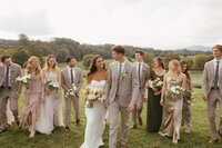 Bride & groom with wedding party at Renback Barn. Bouquets by Flowergirl Cville. Photography by Brittany Stark Studios.