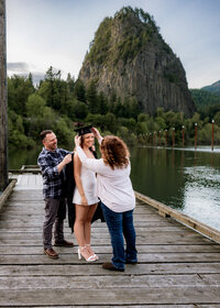 Sandy High School Senior with her mom and dad for her cap and gown session at Beacon Rock State Park