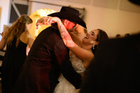 a bride and groom dance during their wedding reception