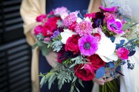 Colorful, pink anemone wedding bouquet flowers