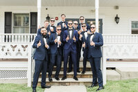 Groom getting ready at Crossed Keys Inn local lodging in Andover NJ on his wedding day