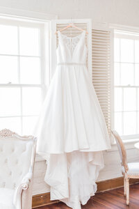 Wedding Dress Hung on Window Shutter New Orleans