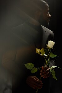 shot-with-ghost-glare-of-black-man-holding-white-r-2025-03-09-08-44-03-utc