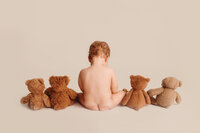 Baby posed with stuffed bears during Milestone Photoshoot at Holy City Babies Portrait Studio in Charleston, SC.