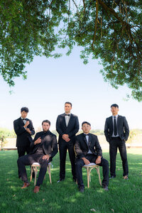 editorial groomsmen photo under tree at rainbow oaks ranch in sanger california