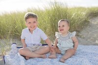 A coastal New England family session with toes in the sand and salty snuggles by the water's edge. North Shore Family Photographer. Deborah Zoe Photography.