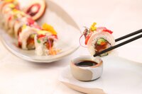 Commercial food photography of a sushi roll for a luxury Marriott hotel restaurant, styled for hospitality marketing across website, social media, in-room dining menus, and press