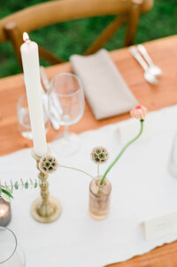 Two floral stems in a vase on the reception tables