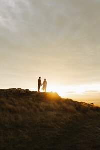 Couple on top of a rock on Port Hills during a couple session in Christchurch