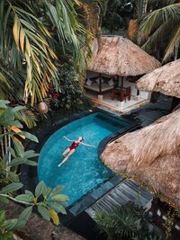 Luxury private pool surrounded by lush greenery, perfect for a secluded boutique travel experience.