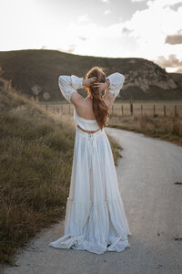 Woman posing with beautiful dress on Hawkes Bay Family Photoshoot with Lightekkeper Photography