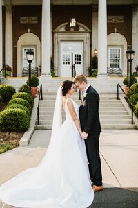 Best Louisville Kentucky wedding venue with bride and groom posing outside Olmsted