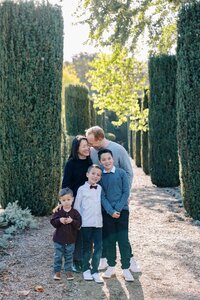 Family of five embracing at Filoli during their holiday photo session