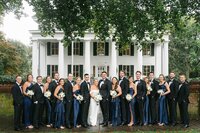 large bridal party photos on burr mansion lawn