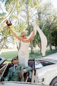 playful-bride-groom-vintage-convertible.jpg