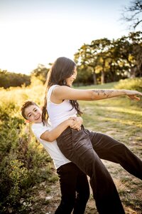 A boy playfully hugs his mom at an out door session in Southlake, Texas