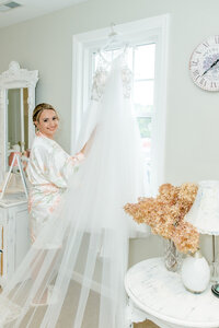 Bride with her wedding dress inside The Love Loft in Monroe, CT