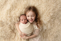 Newborn sibling photo in the Louisville studio.