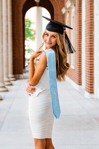 Vanderbilt ADPi wearing white dress and grad cap