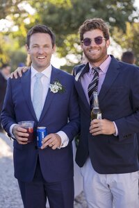 Guests enjoy outdoor cocktail hour during Nantucket wedding reception.