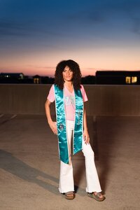 MTSU ZTA sorority senior standing on the parking garage roof at sunset