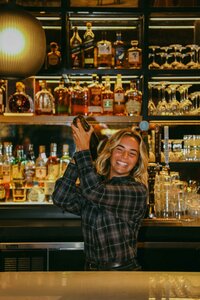 Bartender pouring at the Lobby Bar's back bar