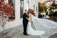 Bride and groom portraits outside The Refinery, a top wedding venue near Louisville with industrial brick walls
