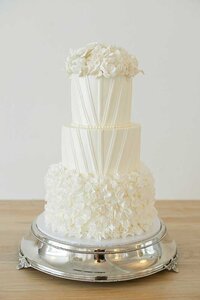 delicate white wedding cake silver platter