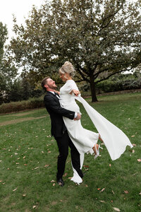 Hannah and Kyle candid wedding moment at Dallas Arboretum
