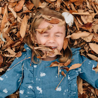girl in autumn leaves melbourne family photography
