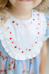 Close up photo of the embroidery detail on a Dondolo christmas dress