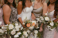 Wedding bouquets of roses, cosmos, and dahlias by Flowergirl Cville. Photography by Brittany Stark Studios.
