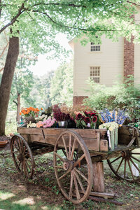 Floral arrangements in a wooden carriage