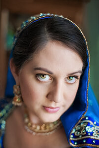 A close up view of a woman in a blue veil