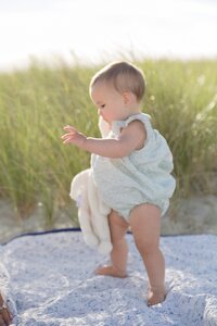 A coastal New England family session with toes in the sand and salty snuggles by the water's edge. North Shore Family Photographer. Deborah Zoe Photography.