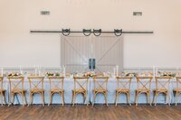 King Family Vineyard barn reception setup with floral centerpieces by Flowergirl Cville, Charlottesville wedding florist | Photo by Paige Ryan Photography