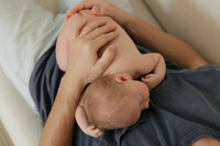 dad-newborn-overhead-hands-chest-hold-in-home-boulder-photographer-237