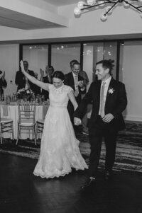 bride and groom celebrating at wedding reception