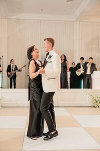 groom dances with mother