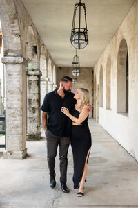 Couple dressed in black for their engagement photos in St. Augustine. Captured by Phavy Photography