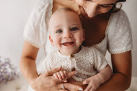 Charleston Baby Milestone Photographer - mother holds her baby during Baby Milestone Portraits in Charleston, SC.