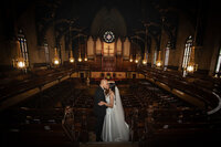 bride and groom kissing in Detroit Church Wedding Photography by Savvy Shoots Photography